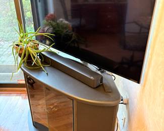 LG TV, soundboard, and media cabinet