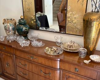 Sideboard by Henredon, Asian vases, Asian mirror with panels, and crystal and silver-plated bowls and accessories
