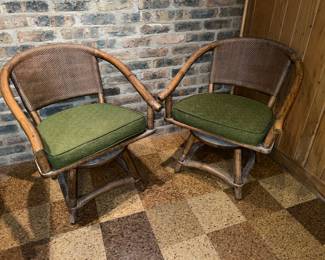 Pair of rattan Swivel Armchairs green cushions 
