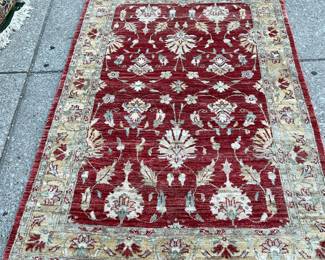 Red and beige area rug (9’ x 4’)