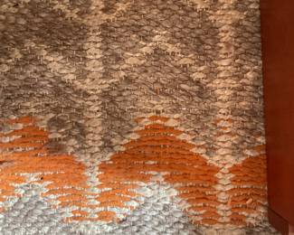 Orange, gray, white woven area rug