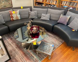 Curved leather and cloth sectional sofa $2100 + tax (depth=35” height of seat=14” height of back=30” length of each section=58”)