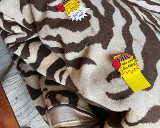 Large brown and cream zebra print rug (20’ x 18’) $1750 + tax