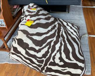 Large brown and cream zebra print rug (20’ x 18’) $1750 + tax