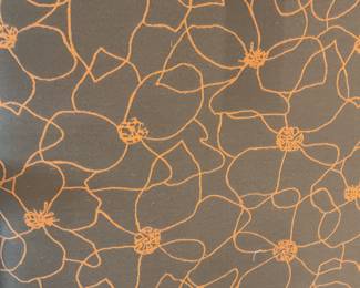 Brown and orange floral motif ottoman (15” tall x 28” x 28”)
