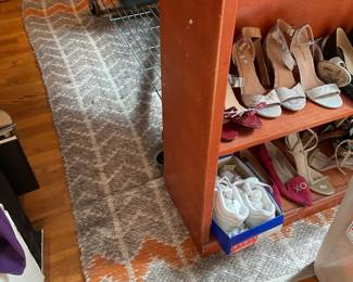 Orange, gray, white woven area rug