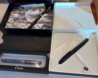 Pilot Vanishing Point, Elite 95S, Namiki Custom 823 Black Smoke, Custom 74 Blue Stone, and Metropolitan (not all pictured) fountain pens