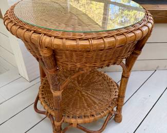 Wicker side table with glass top. 