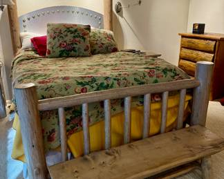 A rustic Lodge pole pine Queen bed with mattress. 
