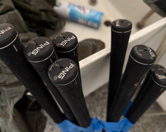 a complete set of ping golf clubs.