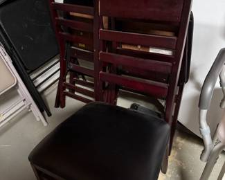 A set of 4 wood, folding chairs.