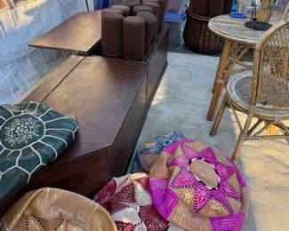 More poufs, breakfast nook seating that opens for storage and is cedar-lined