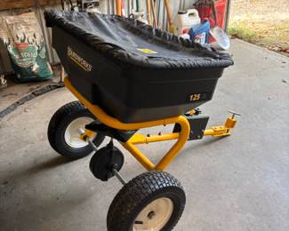 Pull behind spreader