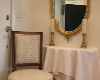 Oval Mirror, Brass Candle Holders And Chair.