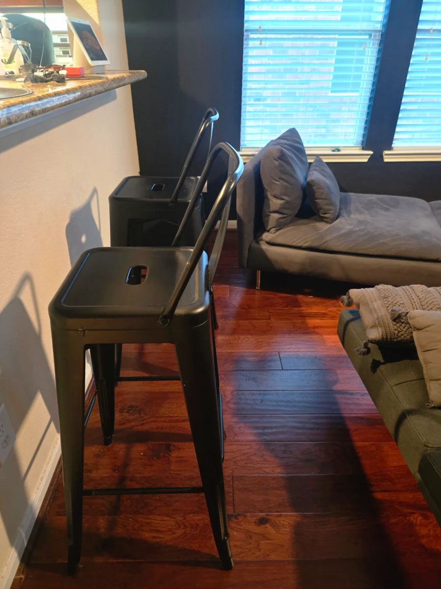 Two metal high bar stools in like new condition. Black, metal, bought from Amazon and no scratches. Industrial look! Come as a pair.