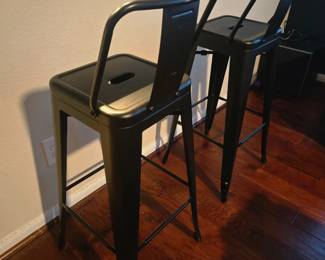 Two metal high bar stools in like new condition. Black, metal, bought from Amazon and no scratches. Industrial look! Come as a pair.
