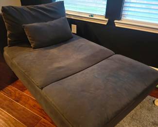 Grey futon chase -there are two as a set and comes with large and small pillow. They havs silver legs and still in great condition-no rips or tears!