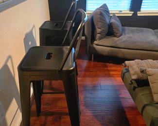 Two metal high bar stools in like new condition. Black, metal, bought from Amazon and no scratches. Industrial look! Come as a pair.
