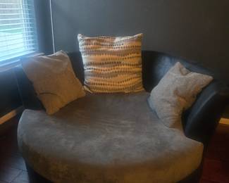 Bolster chair in great condition and desks 2-3  comfortably! The perfect movie chair, comes with pillow assortment. Very sturdy and goes with the couch set. Does not roll or have wheels-back is in excellent condition. No rips or tears.