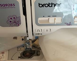 The Brother SQ9285 is a computerized sewing and quilting machine that offers a wide range of features for both beginners and advanced users, including 150 to 205 built-in stitches (depending on the version), an automatic needle threader, and a drop-in bobbin