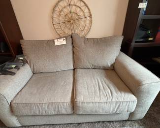 tannish/taupe love seat