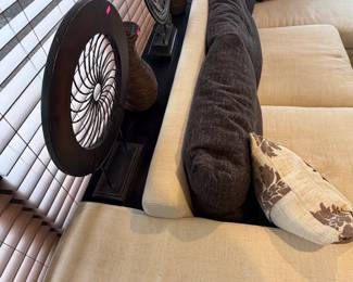 Unique off-white sofa with a built-in storage unit—like having a sofa table perfectly integrated