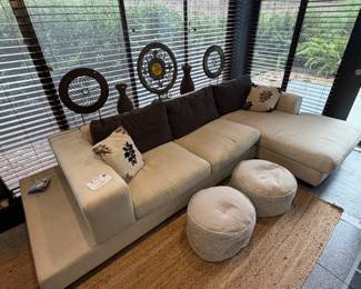 Unique off-white sofa with a built-in storage unit—like having a sofa table perfectly integrated