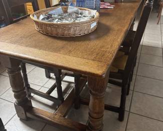 Antique English oak farm table and 7 chairs