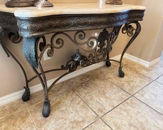 Marble-Top Ornate Wrought Iron Entry / Foyer Console Table
Elegant and sturdy console table featuring an ornate wrought iron base with scrolling detail and a polished marble top. Perfect for an entryway, hallway, or living room accent. Excellent condition — timeless and sophisticated design.