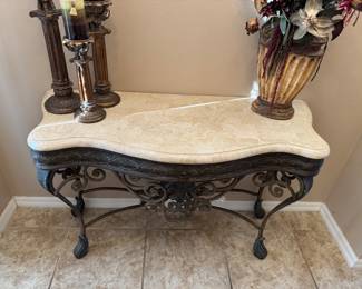 Marble-Top Ornate Wrought Iron Entry / Foyer Console Table
Elegant and sturdy console table featuring an ornate wrought iron base with scrolling detail and a polished marble top. Perfect for an entryway, hallway, or living room accent. Excellent condition — timeless and sophisticated design.