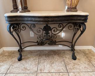 Marble-Top Ornate Wrought Iron Entry / Foyer Console Table
Elegant and sturdy console table featuring an ornate wrought iron base with scrolling detail and a polished marble top. Perfect for an entryway, hallway, or living room accent. Excellent condition — timeless and sophisticated design.