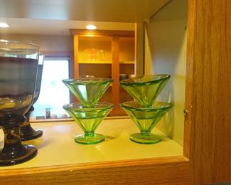 Uranium glass.   I know you're going to ask, so we checked.  It glows.