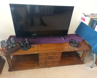 TV stand, TV and binoculars.  You won't need those, it's big enough to see across the room