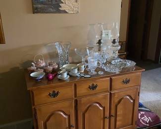 wood cabinet and vintage dishes