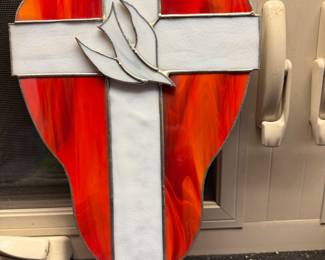 Stained glass crucifix and dove