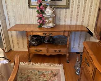 #33 - $350 - Serving table 63wx30tx17d with drop sides on casters