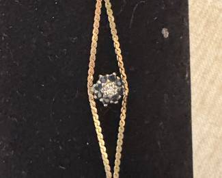 #12J - $116 - 14kt yellow gold bracelet w/sapphire flower - 7"L - 2.02 grams. 