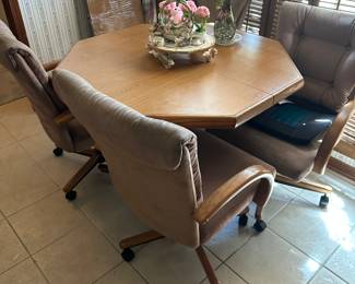 #48 - $200 - Octagonal kitchen table 41x41x30 with 4 chairs on casters - has leaf for table