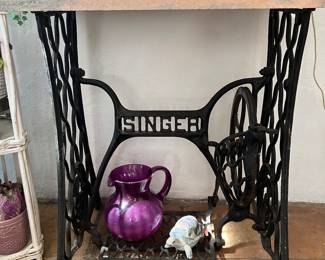 Antique sewing machine stand with marble top
