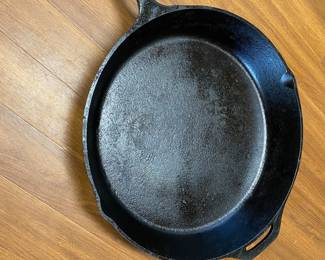 Large Cast Iron Skillet Blackened in excellent condition. 13' across the bottom and 15" across the top