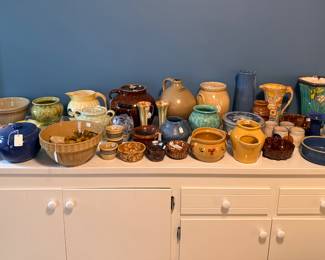 Large Collection of Pottery including Cherokee Hand Made Pot, Large Bean Pot with Lid, Old Yellow-ware Cookie Jar, Blue Stone Ware Vase, and much more...