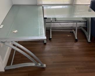 Computer tables tempered glass smaller one- 48inch wide by 30 long $80 Larger one 60 in wide by 30 in long $100