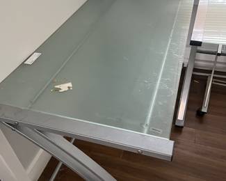Computer tables tempered glass smaller one- 48inch wide by 30 long $80 Larger one 60 in wide by 30 in long $100
