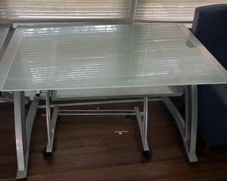 Computer tables tempered glass smaller one- 48inch wide by 30 long $80 Larger one 60 in wide by 30 in long $100
