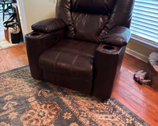 leather recliner with cup holders       area rug 