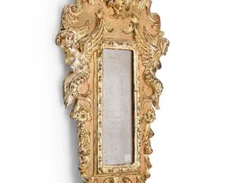 1368
A Baroque-style carved giltwood frame
Late 20th/early 21st century
Sticker applied verso: D A / Style no. 708 / Made in Italy
The frame depicting cherub masks and opposed winged mermaid figures
24" H x 13.25" W x 2.25" D
Estimate: $100 - $150