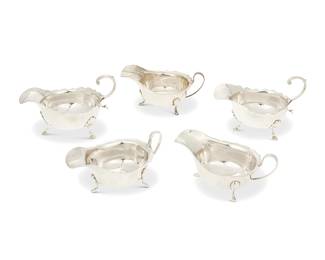 1346
A group of English sterling silver sauceboats
1880s and 1931
Each marked for sterling; three marked for Sheffield, date, and maker: EV [Viner's Ltd (Emile Viner)]; two marked for Birmingham, date, and maker: GNRH [George Nathan & Ridley Hayes]
Comprising a pair of sauce boats with scrolled handles and hoof feet (3.75" H x 6.25" W x 3.625" D), and a set of three sauce boats (2.625" H x 5.875" W x 3.5" D), each with scalloped rim
5 pieces
19.8 oz. troy approximately
Estimate: $400 - $600