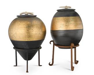 1480
Michael Weinberg (1953-2016)
Two raku-style stoneware lidded pots, late 20th/early 21st century
One incised to underside: Weinberg
The painted jars, each fired in the Japanese style, banded with variegated gold leaf, the lid mounted with an elk antler handle, set in an associated painted iron stand
2 pieces
Taller pot: 17" H x 13" Dia.; Shorter pot: 14.75" H x 11.5" Dia.; Larger stand: 10" H x 12" Dia.
Estimate: $200 - $400