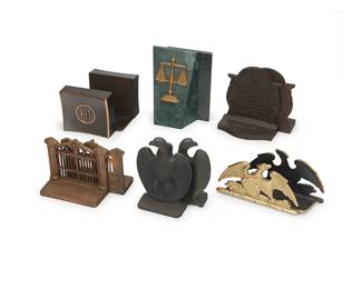 1447
Six pairs of book ends
20th century
Brass eagles marked in the molding: Spread Eagle / Copyright 1952 / VA Metal Crafters
Comprising metal eagles, brass eagles, metal gateways, metal plaques, monogrammed 'M' metal and composite, and brass scales mounted on marble
12 pieces
Tallest: 8" H x 5.25" W x 2.75" D; Shortest: 4.25" H x 7.625" W x 2.5" D
Estimate: $100 - $150