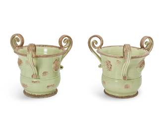 1372
A pair of Arte Italica ceramic jardinières
Early 21st century
Each marked in a raised stamp: Arte-Italica / Made in Italy
The partially green-glazed urn-form earthenware planters, each with three scrolled handles and floral medallions in relief to body
2 pieces
Each: 18" H x 20" Dia.
Estimate: $200 - $400